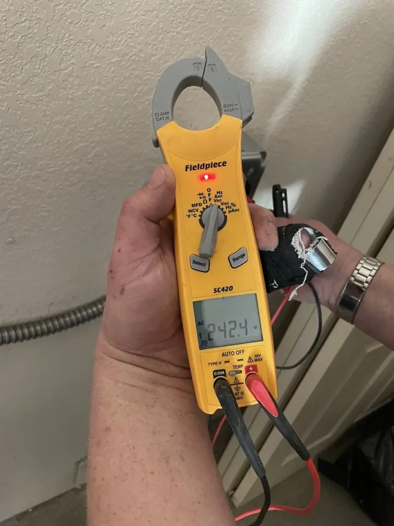 Voltage testing with clamp meter during Whole House Surge Protector in Bonham